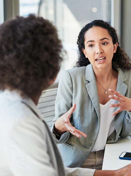 Two business women talking