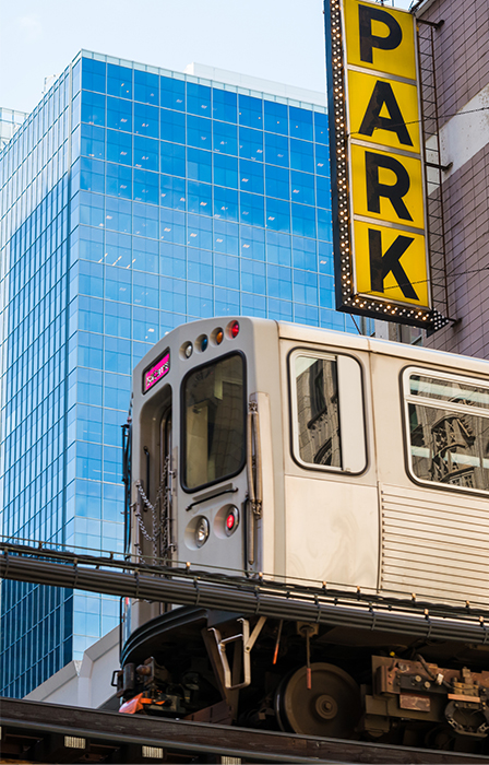 Image of the L Train passing a parking garage in the famous loop in Chicago