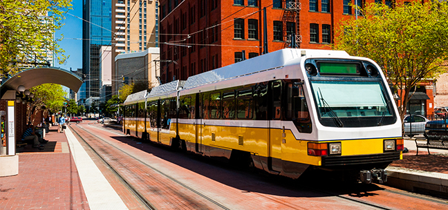 DART light rail train at a station in downtown Dallas.
