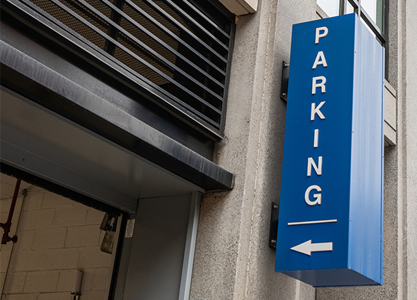 Image of a parking garage entrance sign in Washington, D.C on a rainy day