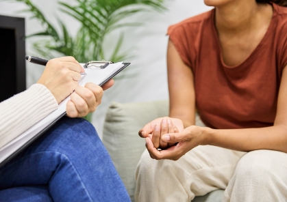 Women with pad of paper counseling